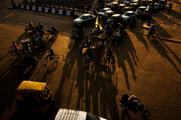 17 February 2009: Delhi, India: Motorists drive through rush hour traffic