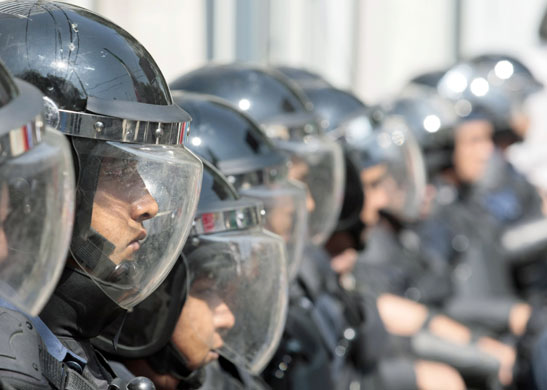 17 February 2009: Mexico City, Mexico: Riot police stand guard as farmers stage a protest