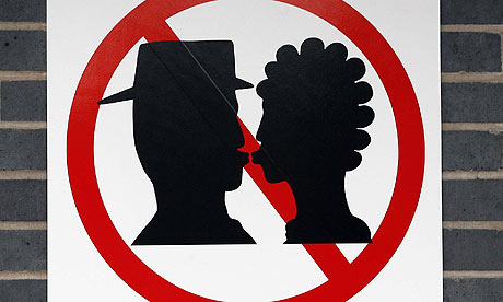 A No Kissing sign at Warrington Bank Quay station
