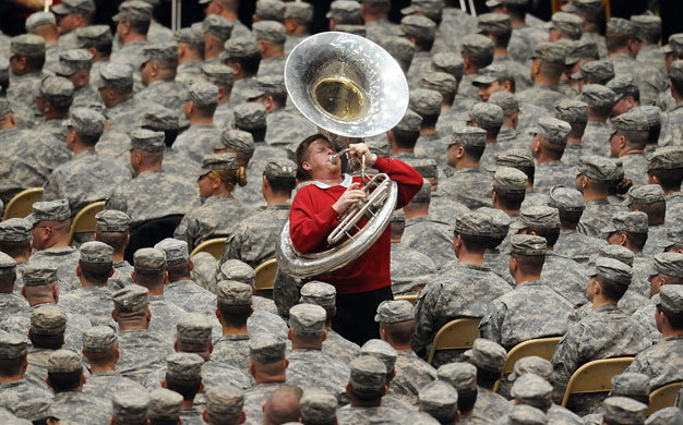 24 hours in pictures: MArching band entertains Iraq bound troops in USA