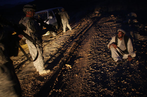 19 February 2009: Nuristan Province, Afghanistan: A man is questioned by the US Army