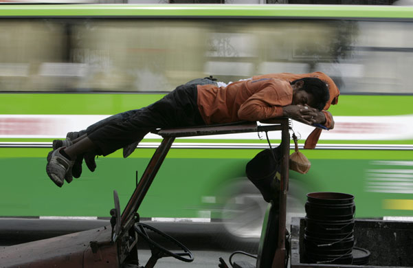 19 February 2009: Manila, Philippines: A construction worker takes a break