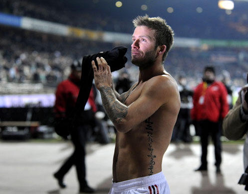 24 Sport: Beckham gives his shirt to supporters after the match in Bremen
