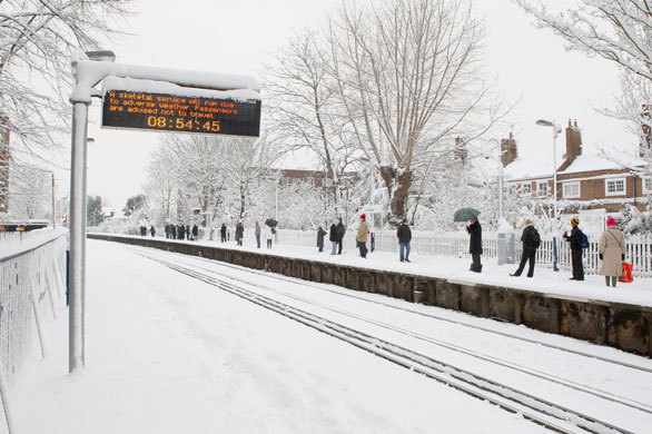 Gallery Snow in England: Mortlake: A sign advises passengers at Mortlake train station.