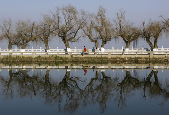 Gallery 24 hours in pictures: A man fishes on the banks of Dianchi Lake in Kunming, China