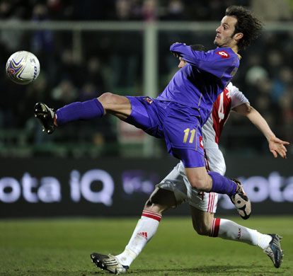 24 Sport: Alberto Gilardino launches himself for the ball