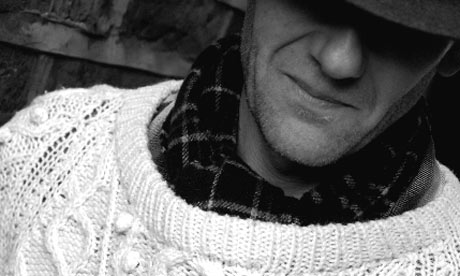 Richard wearing the sweater he's never washed and shares with his wife