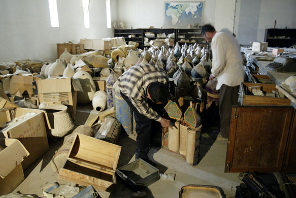 Baghdad museum : Civilians inspect Torah scrolls in the vault of the Iraq National Museum 