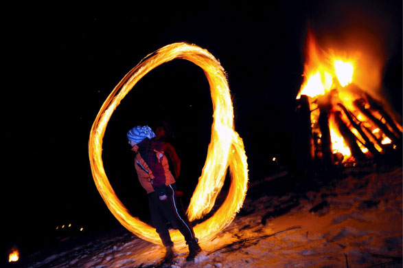 23 February 2009: Goren Lozen, Bulgaria: A boy spins fireballs in order to chase evil spirits