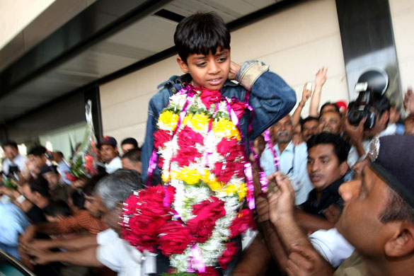 Slumdog children return: Child actor Mohammed Azharuddin at Mumbai airport, India.