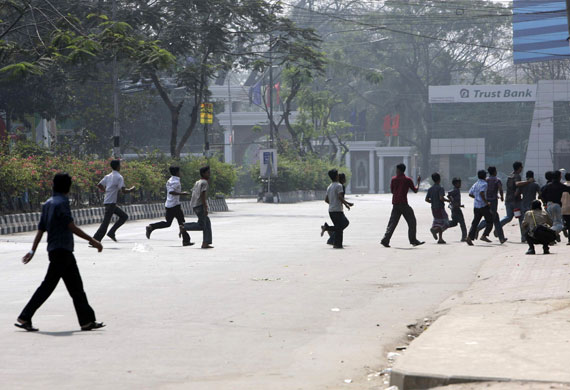 Bangladesh mutiny: Civilians run as firing continues near Bangladesh Rifles HQ.