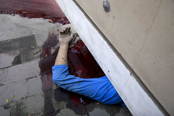 Bangladesh mutiny: A dead body of a Bangladeshi lies in a pool of blood in Dhaka.