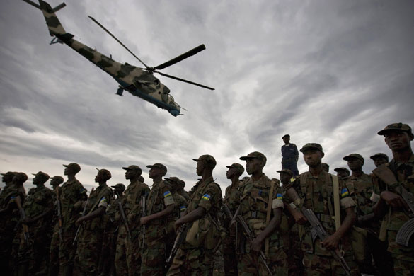 26 February 2009: Goma: A military helicopter flies over Rwandan troops