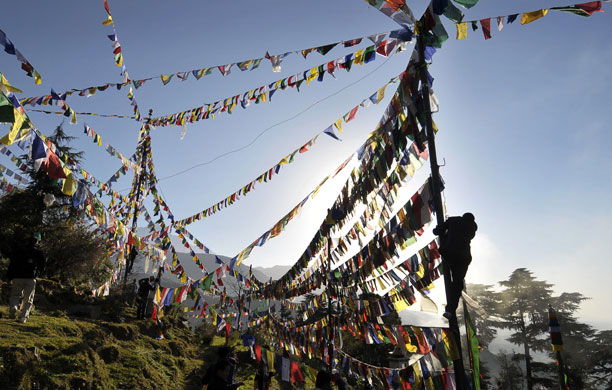 27 February 2009: Dharmsala, India: An exiled Tibetan is silhouetted against the morning sun
