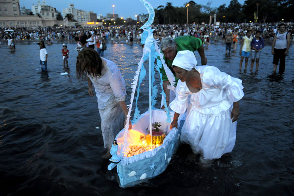 Gallery 3 February 2009: Uruguay: People take part in a ritual for the Yoruba sea goddess