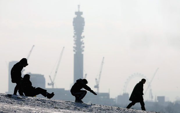 Gallery Snow updated: London: Children sledge down Primrose Hill.