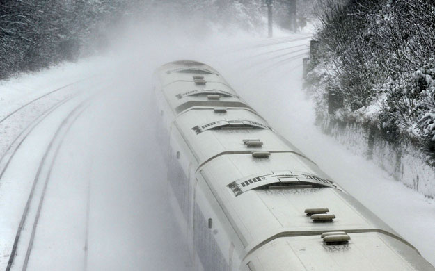 Gallery Snow updated: Farnborough: A train passes through Farnborough Main station. 