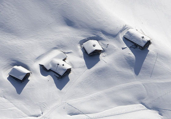 Gallery 24hours in pictures: An aerial view shows a small village in the Swiss Alps