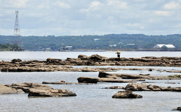 Gallery Severe Drought: Fishermen stand on stones that arose dueto severe drought