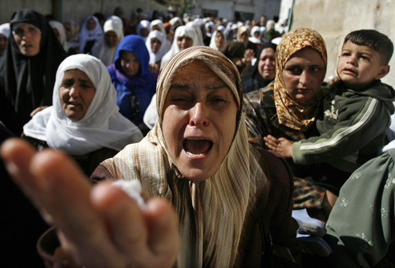 Gallery 24 hours in pictures: Palestinian mourners react during funeral of militant near Jenin