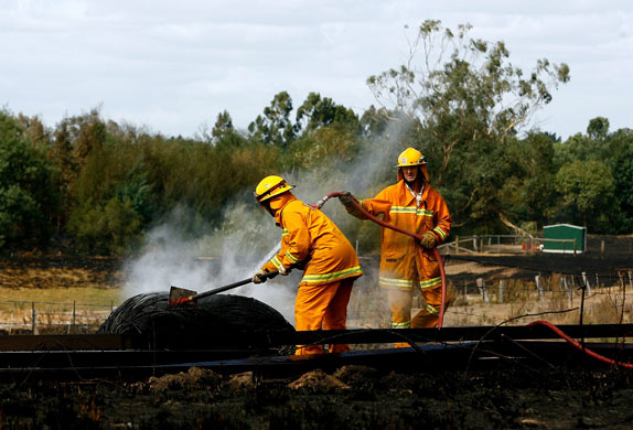 Gallery Australian bushfires: CFA vounteers hose down embers at the Yarra Glen railway station