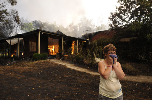 Gallery Australian bushfires: Davina Derrick watches her neighbours house burn in Drouin