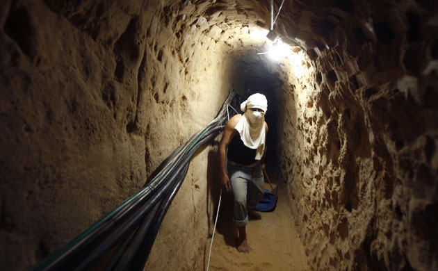 Gallery Tunnels under Gaza: Gaza tunnels Palestinian walks in a smuggling tunnel in Rafah