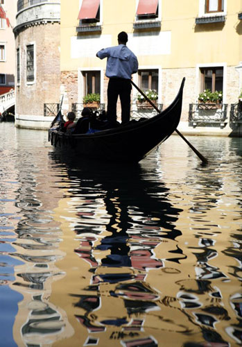 Venice in decline: A gondolier rows his gondola in a canal in Venice, Italy, September 2008. 