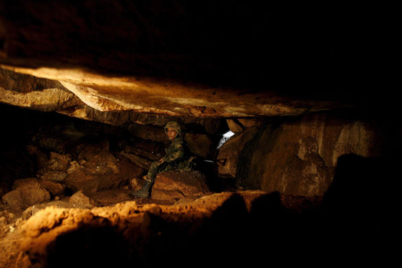 Meta, Colombia: A soldier from the Colombian Army in a cavern.