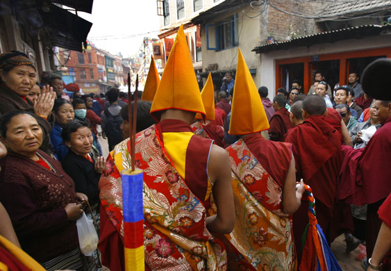 Kathmandu Uprising day: Tibetans in exile watch the procession on uprising day.