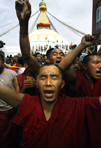 Kathmandu Uprising day: Tibetan in exile shout anti-Chinese government slogans after prayers.