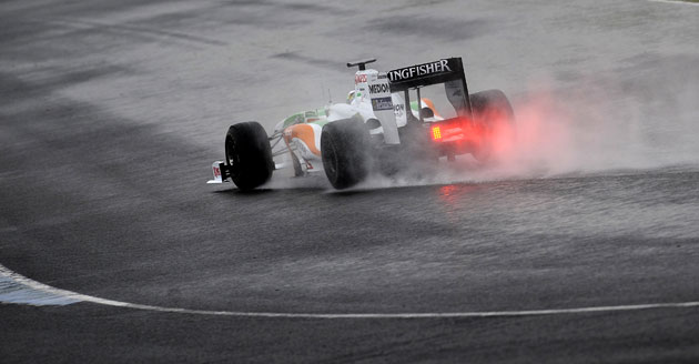 F1 2009 car unveilings: Adrian Sutil corners in his Force India VJM02 during a wet testing session