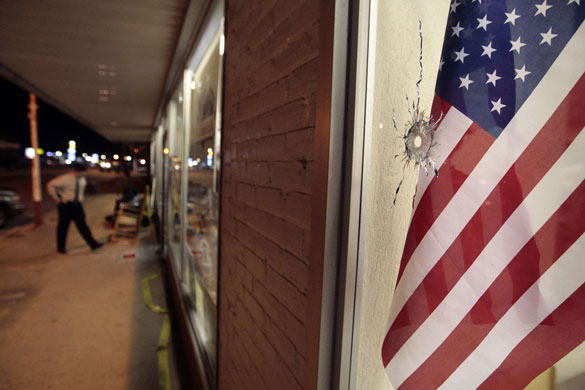Alabama shooting spree: A bullet hole in a window of a hardware store in Samson, Alabama