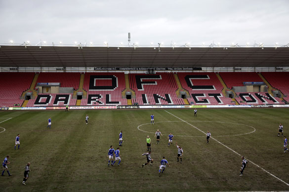 Darlington: A midfield battle on a sticky Darlington Arena pitch.