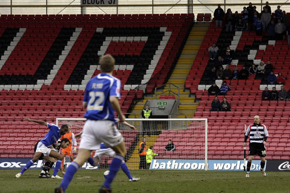 Darlington: The Macclesfield fans look on as two players tussle for possession