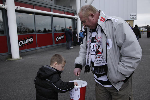 Darlington: A young fan makes his contribution to the Save The Quakers Fund' 