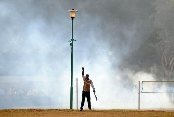 24 hours in pictures: A University of Nairobi student throws stonesat police