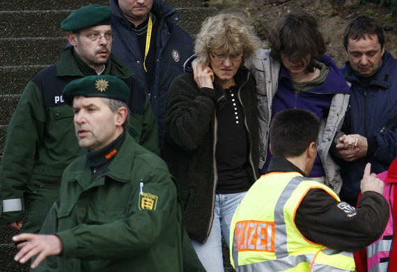 Germany school shooting: Police escort people from a school after a shooting incident in Winnenden.