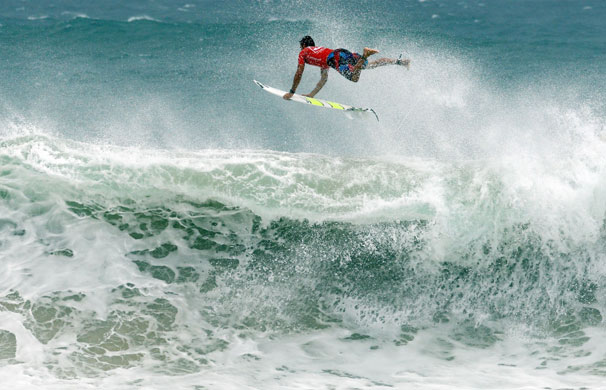 24sport: Joel Parkinson leaps over the back of a wave