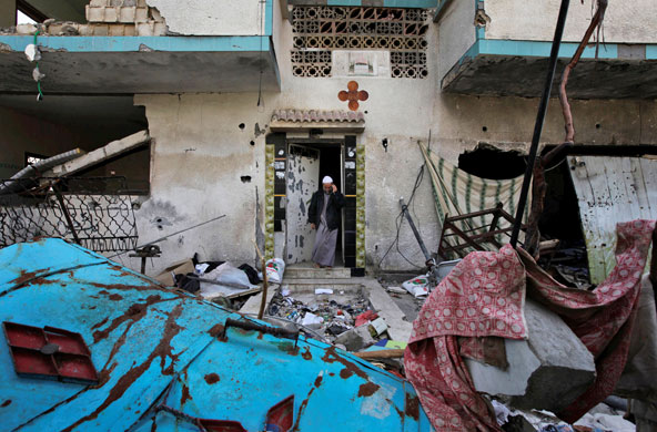 12 March 2009: Beit Lahiya, Gaza Strip: Yousef Attar stands in the doorway of his house