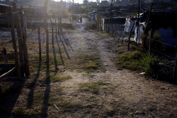 12 March 2009: San Salvador, El Salvador: A woman carries water on her head