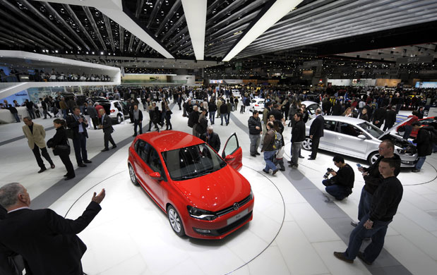 Week in Business: Visitors look at the Volkswagen Polo BlueMotion car at Geneva car show. 