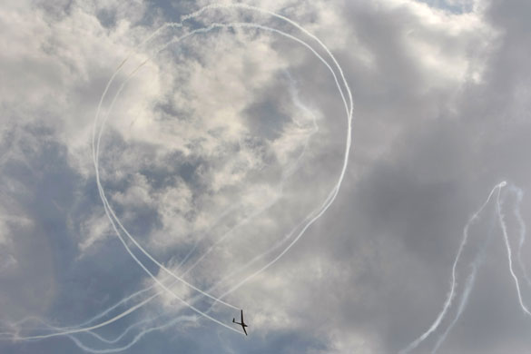 24 hours in pictures: A jet-assisted glider performs a loop during the Australian  Airshow 