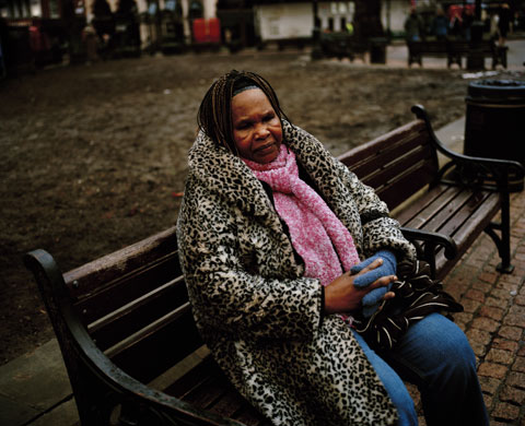 Asylum seekers: 62 year old Anie from Angola sits on a bench in London's Leicester Square.