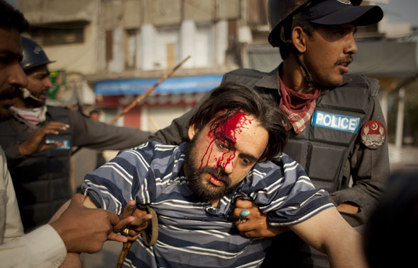 24 hours : anti-government demonstrator is detained by  police officers in Pakistan 