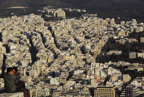 24 hours : A couple kisses during sunset at Lycabetus hill in central Athens