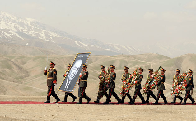 24 hours : Afghan army soldiers carry a portrait of ormer President Mohammad Daud Khan