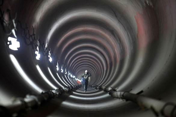 24 hours in pictures : Mexico City, Mexico: A  contruction worker in a  drainage tunnel