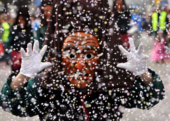 2 March 2009: Weil am Rhein: A person dressed up as a witch during the fools' procession