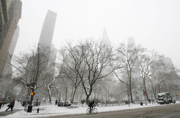 Snowstorm in US: Pedestrians walk near Madison Square Park during a snowstorm in New York